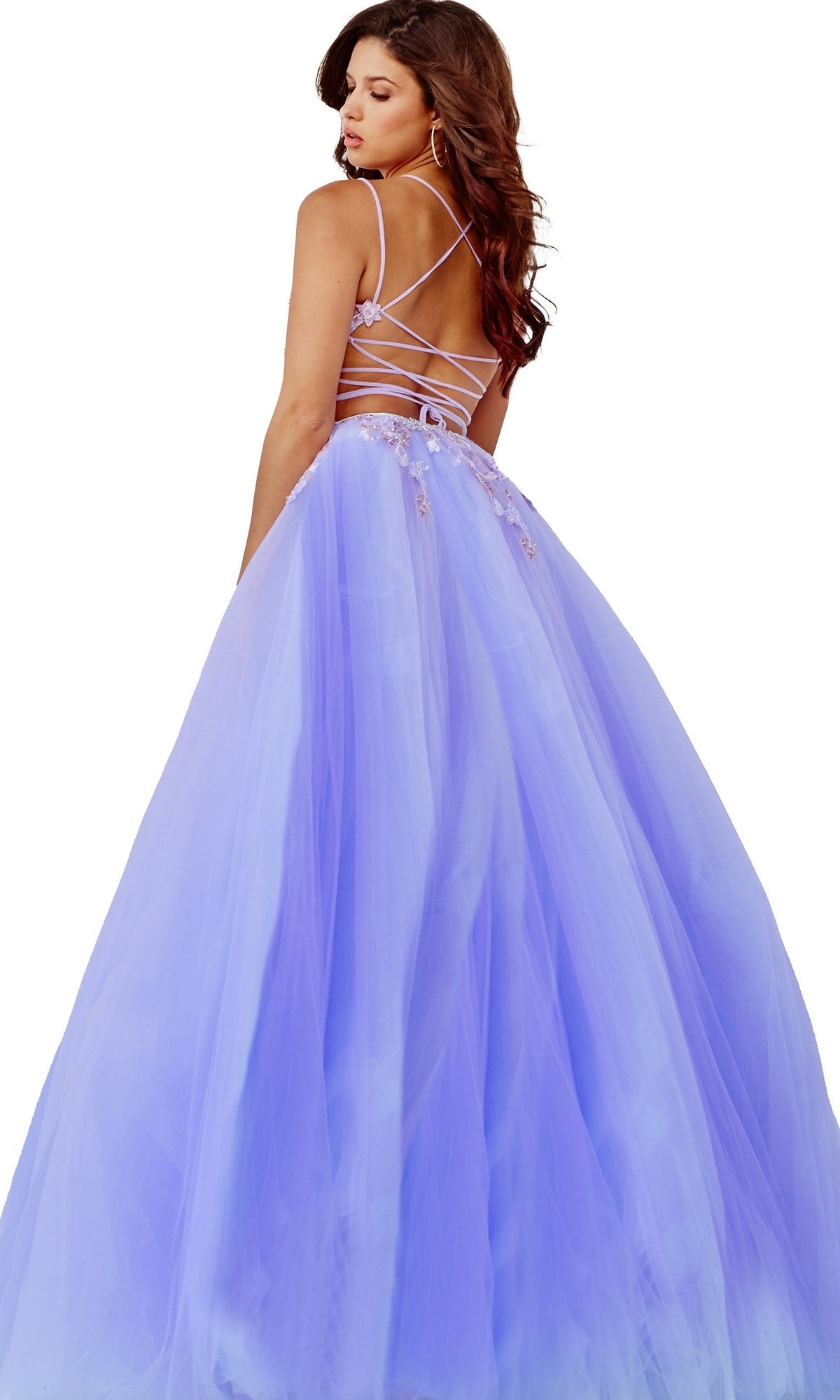 Woman wearing a Lilac Purple Sheer-Bodice Prom Ball Gown by Jovani, featuring a full tulle skirt and thin crisscross straps, looking over her shoulder.